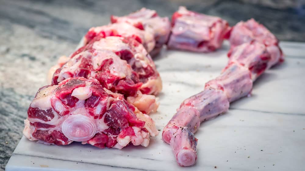 What an oxtail looks like, lined up for its seasoning. It's actually a cow's tail, and not an ox's tail, at all.