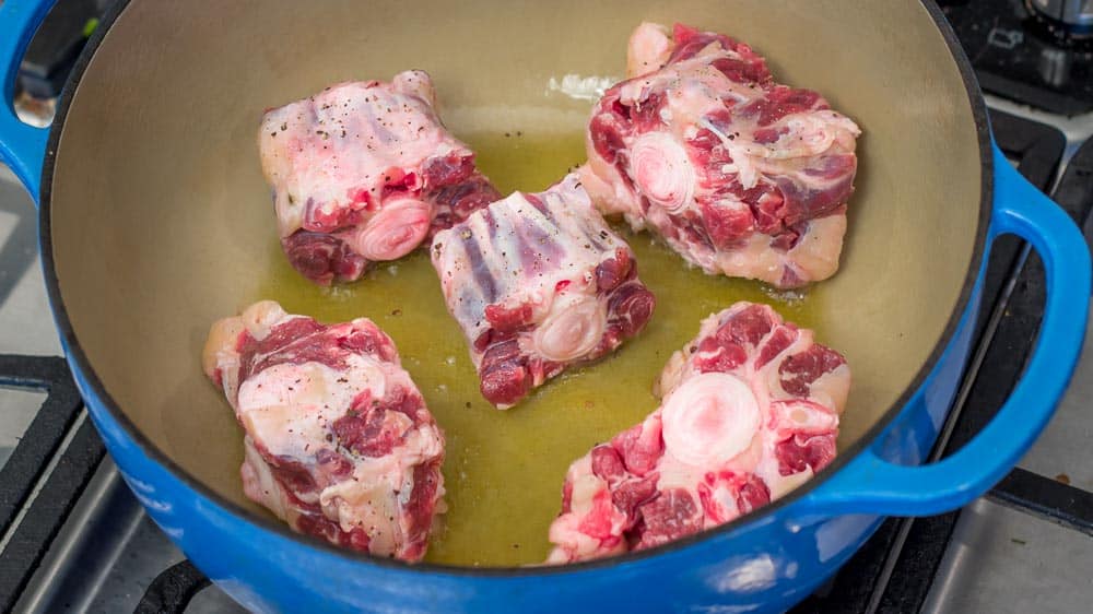 Browning the oxtail. They are not crowded in the pan.