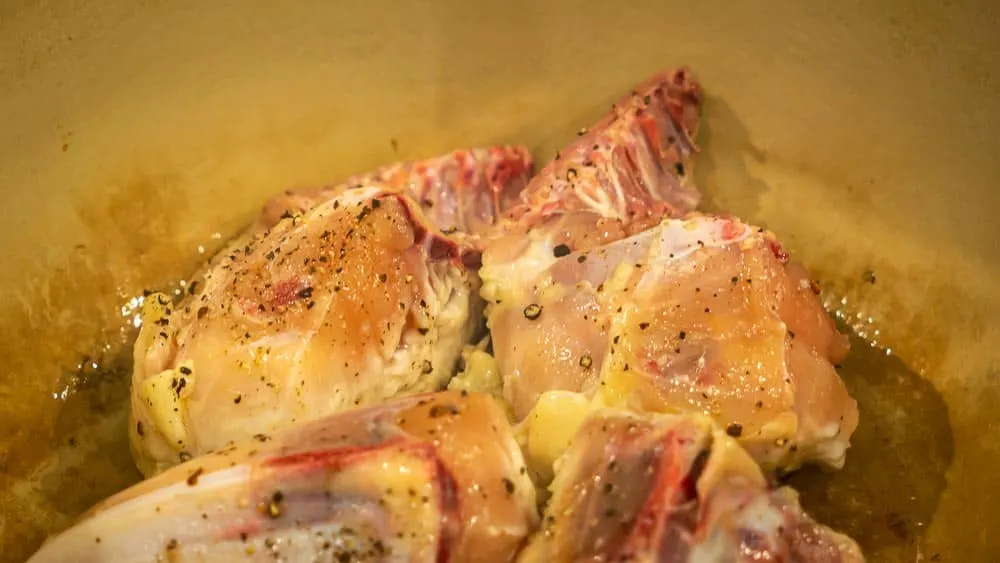 Browning the chicken in olive oil.