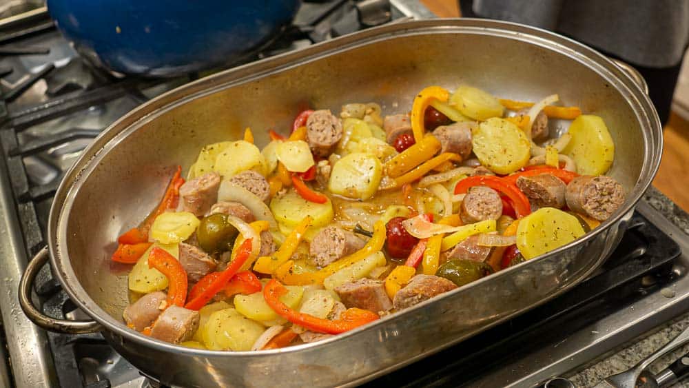 Spread it all out in a large roasting pan, so that everyone is exposed to the heat. Time to go in the oven.