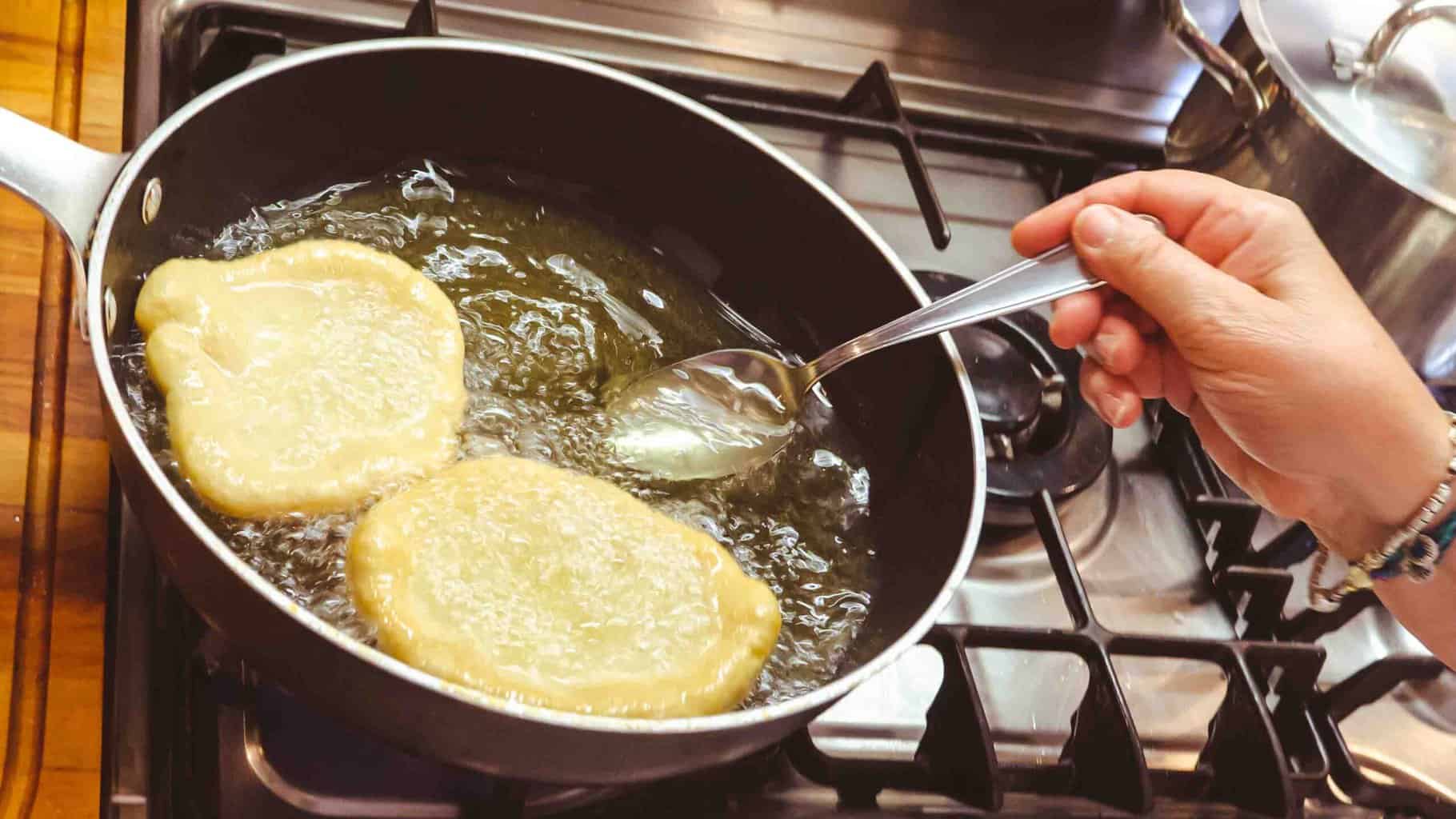 Frying the pizzelle crust.