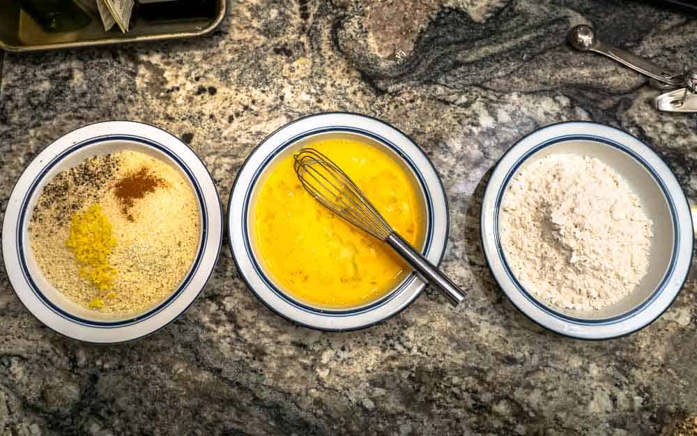 Set up a breading station by positioning three bowls side by side: flour, beaten egg, and seasoned panko.