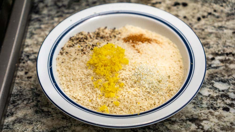 This is the panko with the seasoning ingredients on top, before I've mixed them up. Cayenne, lemon zest, garlic powder, salt, and pepper.