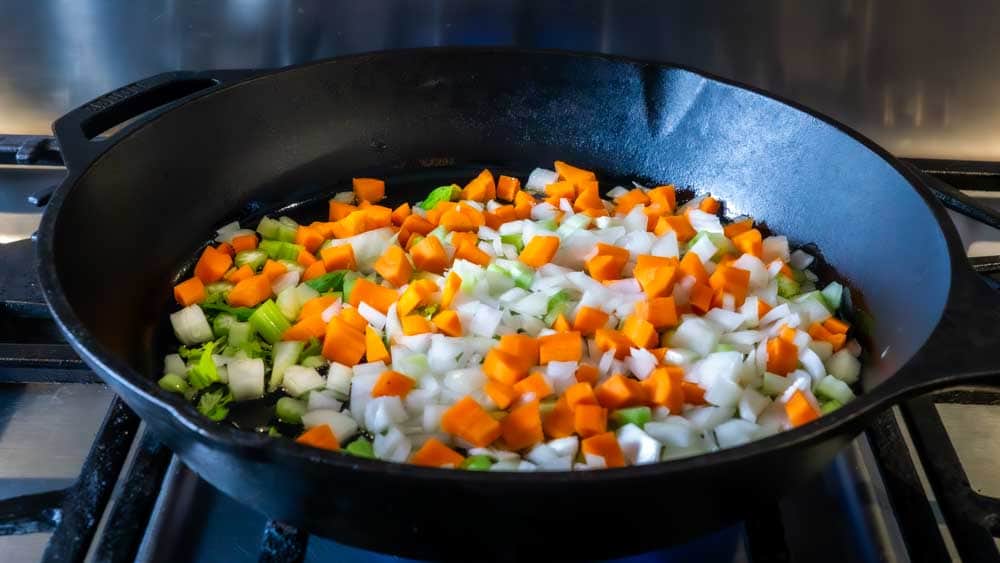 I start by sautéing my mire poix/veg mixture.