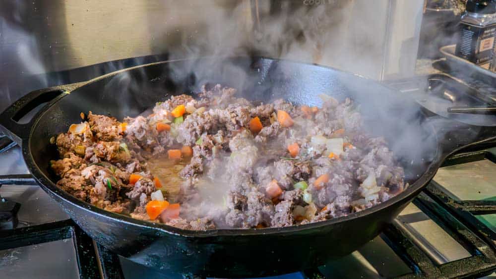 You can see the steam coming off the white wine, as I deglaze the pan.