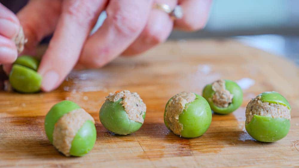 Time to gently stuff the olives. 